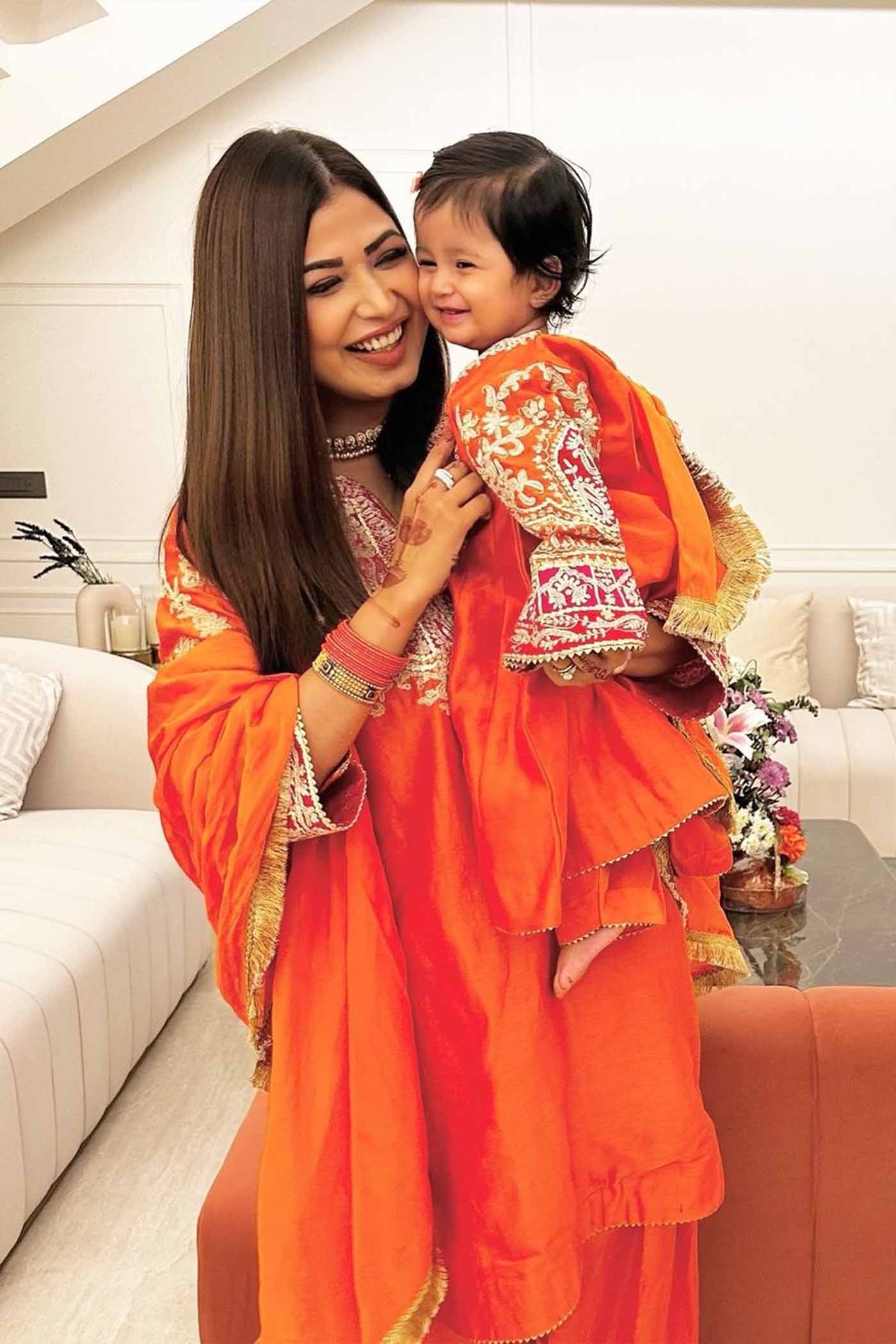 SRISHTI WADHWA IN MOHSINA - ORANGE SHORT KALIDAAR CHOGA WITH SALWAR
