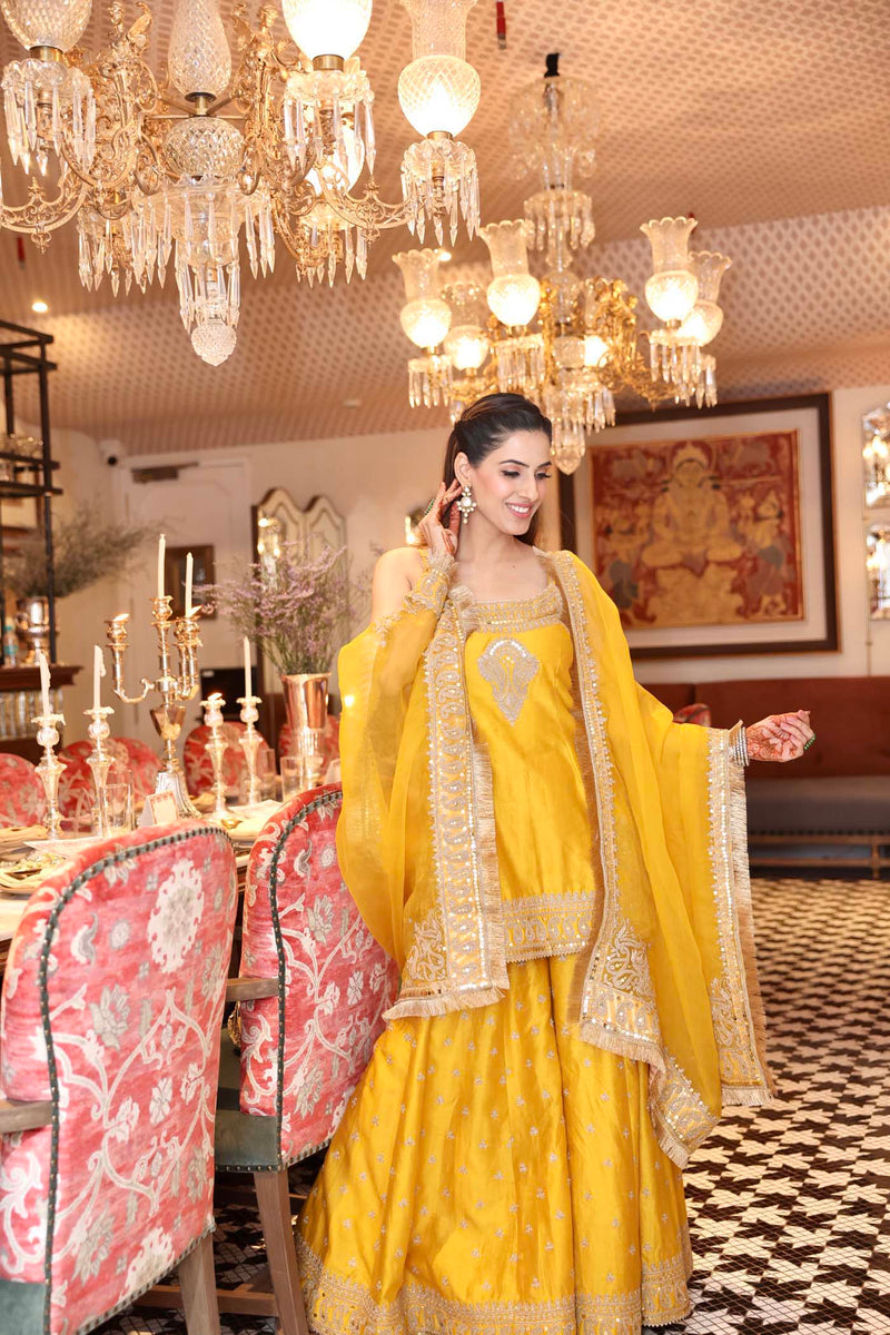 Shruti Juneja In AABROO - Glaze Mustard SHORT KURTA WITH SHARARA AND DUPATTA