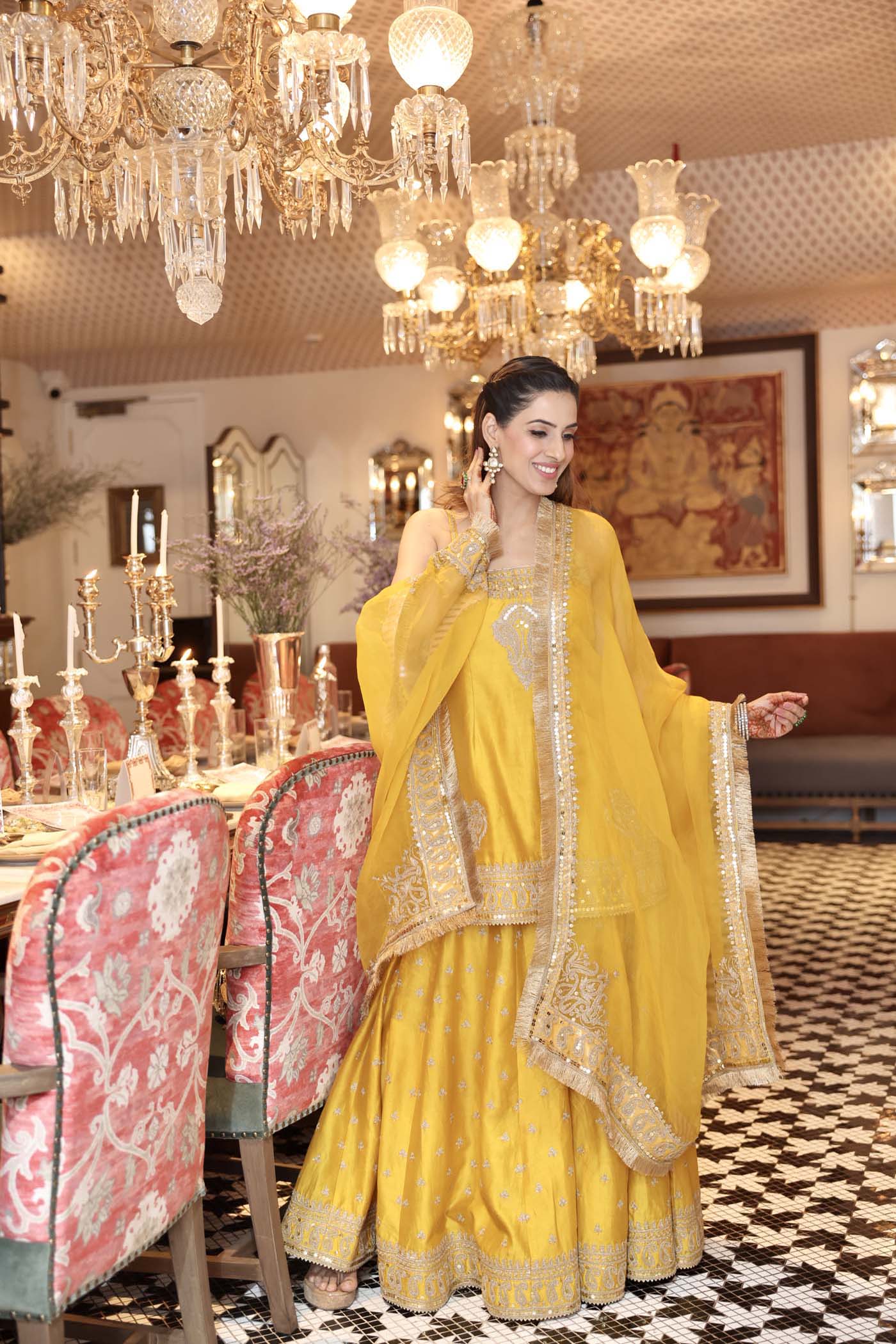 Shruti Juneja In AABROO - GLAZE MUSTARD SHORT KURTA WITH SHARARA AND DUPATTA