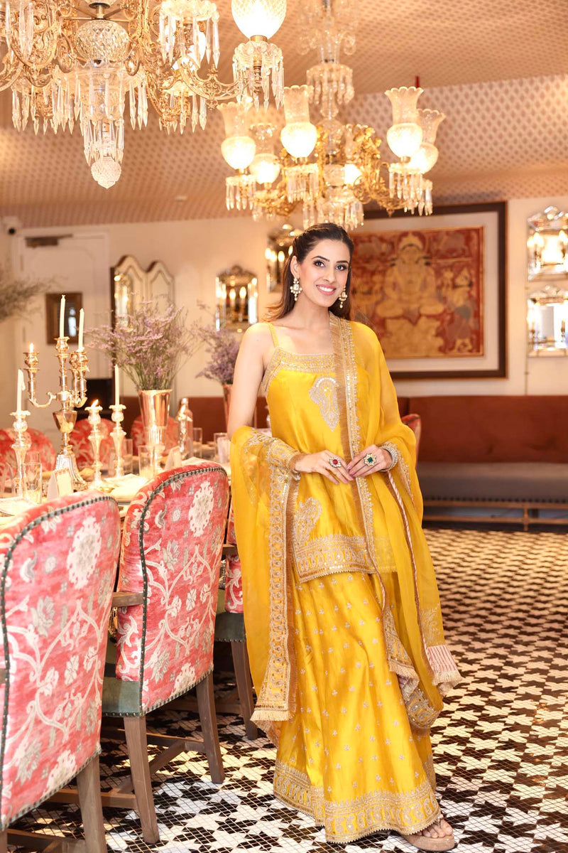 Shruti Juneja In AABROO - Glaze Mustard SHORT KURTA WITH SHARARA AND DUPATTA