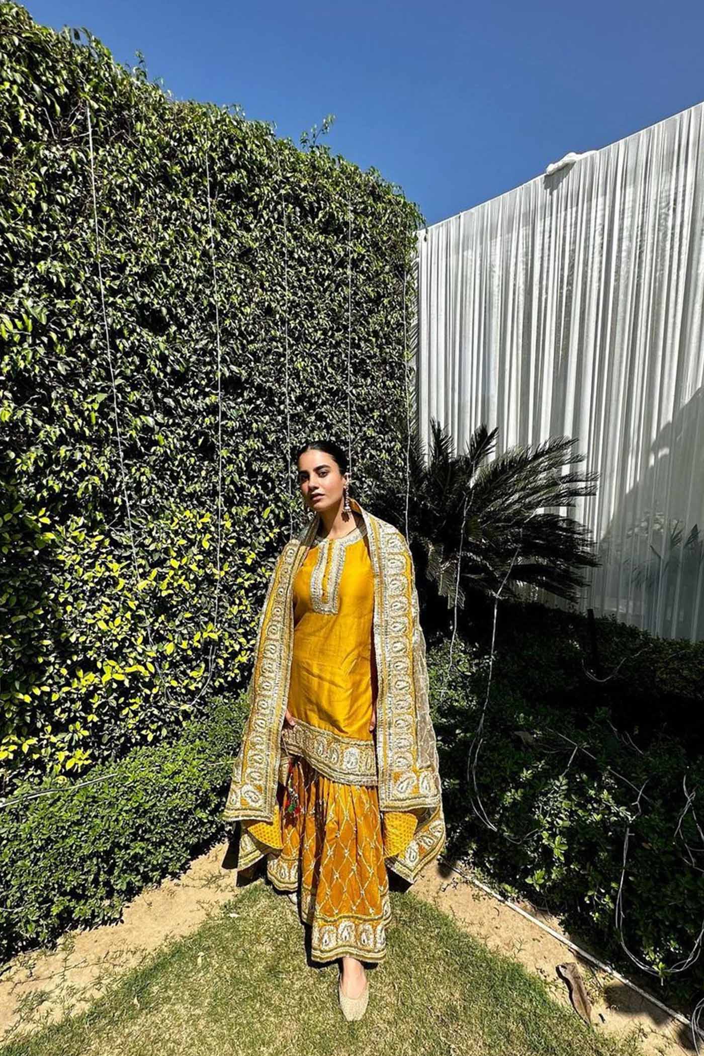 Heena Bhalla IN Shabina- Glaze Mustard  short kurta with garara and dupatta