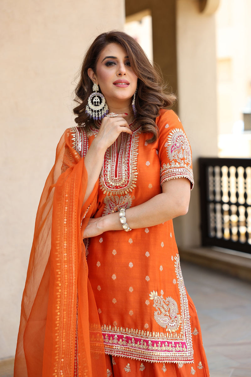 ANJALI KHUSHALANI IN AREESHA - BURNT ORANGE SHORT KURTA WITH SHARARA AND DUPATTA
