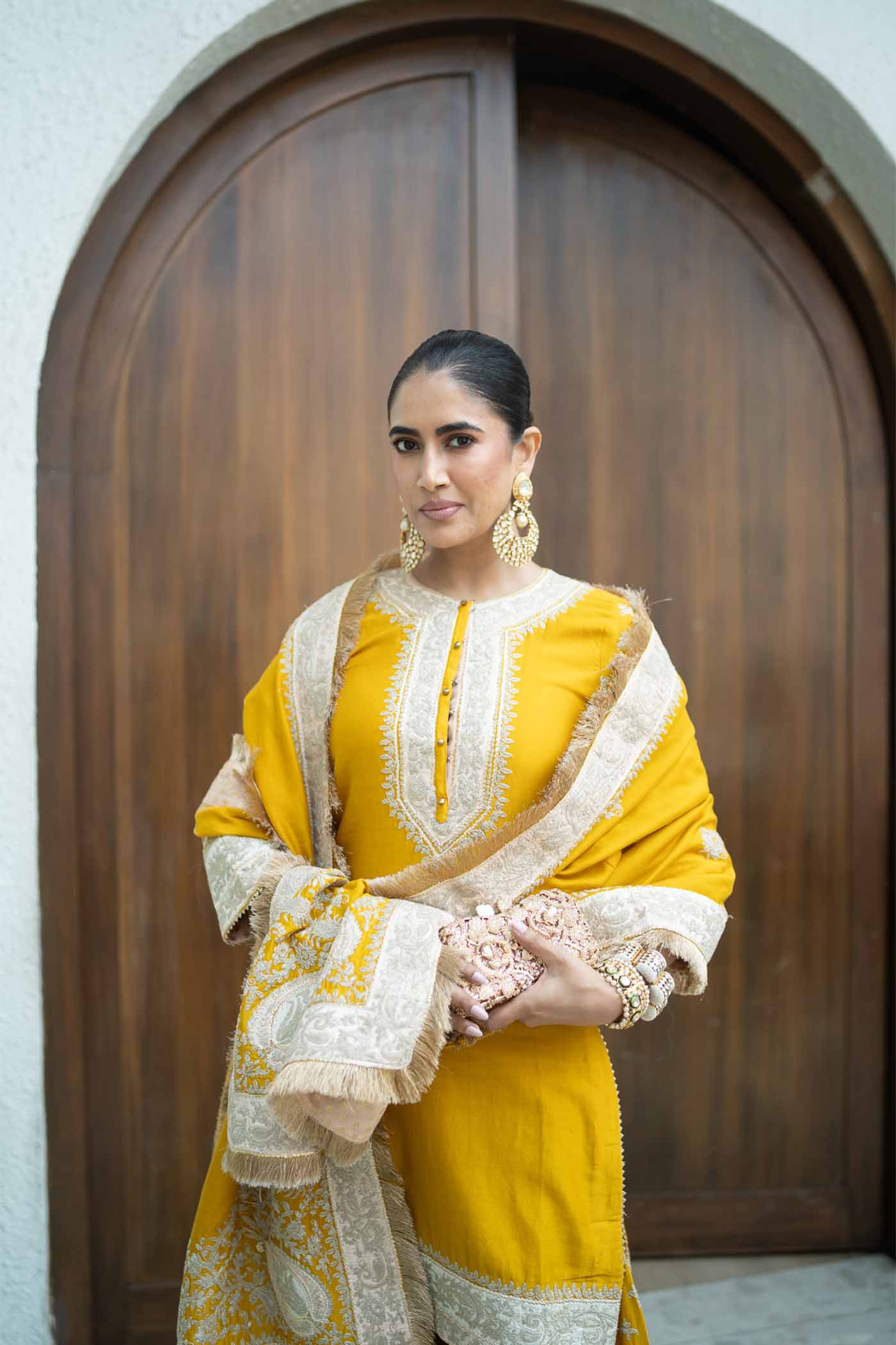 Alisha Pekha In RAINA - GLAZE MUSTARD SHORT KURTA WITH SHARARA AND ODHNI