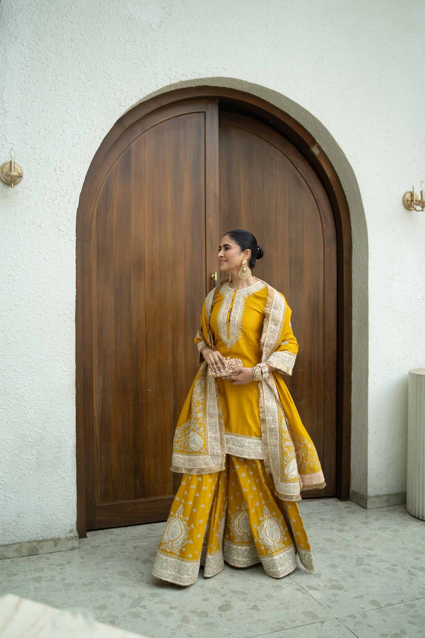 Alisha Pekha In RAINA - GLAZE MUSTARD SHORT KURTA WITH SHARARA AND ODHNI