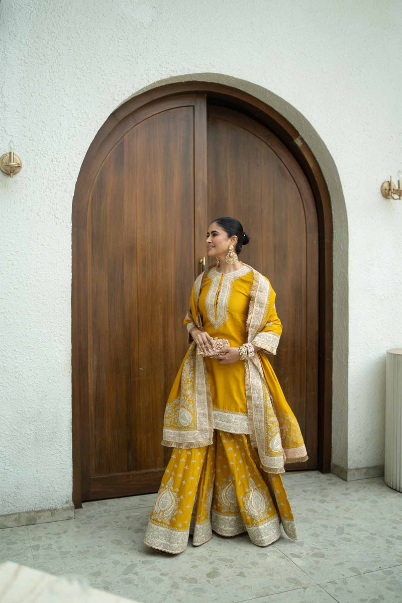 Alisha Pekha In RAINA - Glaze Mustard SHORT KURTA WITH SHARARA AND ODHNI