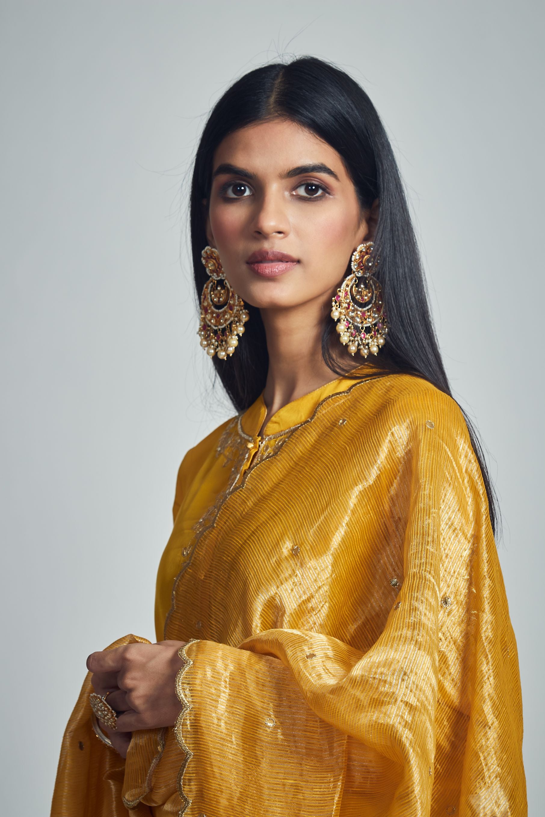 Nazish- Happy mustard Habutai silk embroidered ensemble